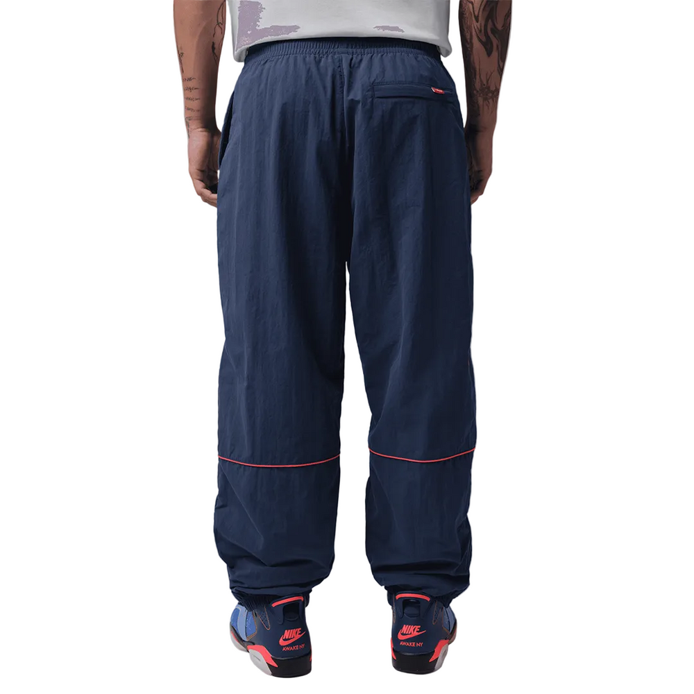 JORDAN X AWAKE NY TRACK PANTS MIDNIGHT NAVY / INFRARED 23